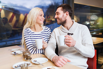 Image showing happy couple meeting and drinking tea or coffee