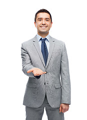 Image showing happy smiling businessman in suit