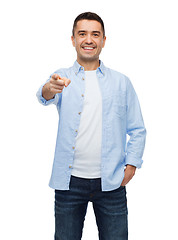 Image showing smiling man pointing finger on you