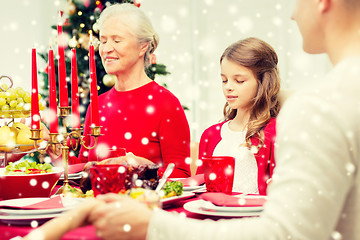 Image showing smiling family having holiday dinner at home