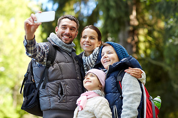 Image showing family taking selfie with smartphone in woods