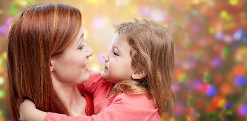 Image showing happy mother and little daughter hugging