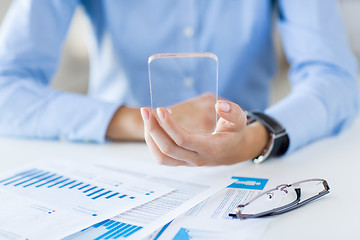 Image showing close up of woman with transparent smartphone