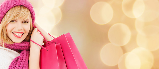 Image showing smiling young woman with shopping bags