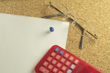 Image showing spectacles and calculator on paper