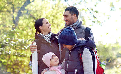 Image showing happy family with backpacks hiking