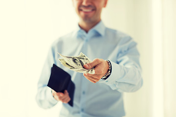 Image showing close up of businessman hands holding money