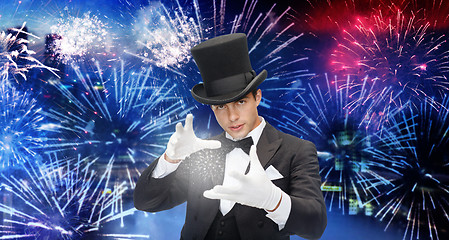 Image showing magician in top hat showing trick