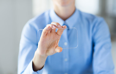 Image showing close up of woman with transparent smartphone