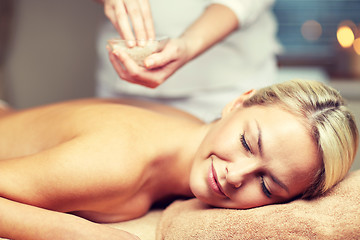 Image showing close up of woman lying and having massage in spa