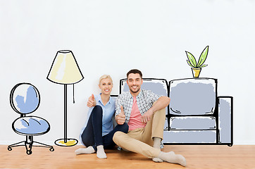 Image showing happy couple showing thumbs up at new home