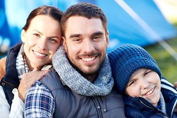 Image showing happy family with tent at camp site