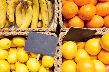 Image showing fruits in baskets with nameplates at food market