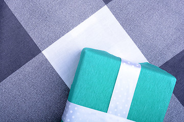 Image showing holiday Green gift box with white ribbon