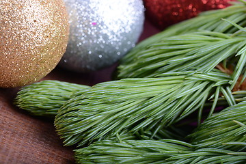 Image showing Decorated christmas tree - holiday background, green tree eve branch close up with christmas balls 