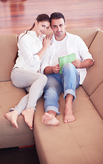 Image showing couple at modern home using tablet computer