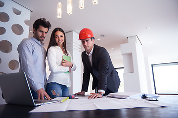 Image showing couple buying new home with real estate agent