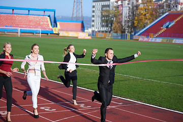 Image showing business people running on racing track