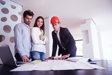 Image showing couple buying new home with real estate agent