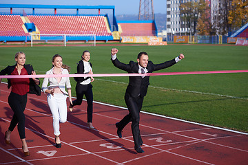 Image showing business people running on racing track