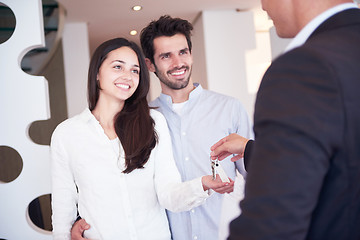 Image showing couple buying new home with real estate agent