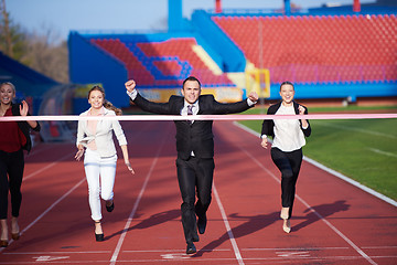 Image showing business people running on racing track