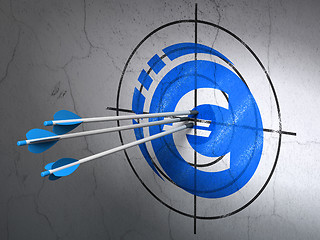 Image showing Money concept: arrows in Euro Coin target on wall background