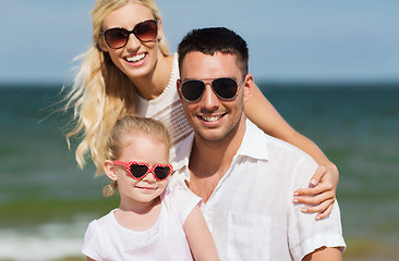 Image showing happy family in sunglasses on summer beach