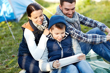 Image showing happy family with tablet pc and tent at camp site