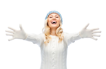 Image showing smiling young woman in winter hat and sweater