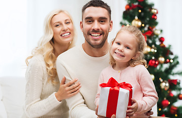 Image showing happy family at home with christmas gift box