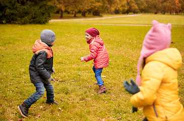 Image showing group of happy little kids running outdoors