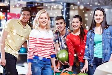 Image showing happy friends in bowling club at winter season