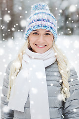 Image showing smiling young woman in winter forest