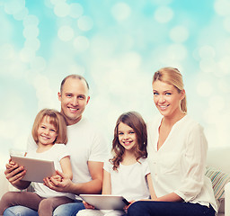 Image showing happy family with tablet pc computers