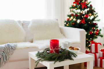 Image showing sofa, table and christmas tree with gifts at home