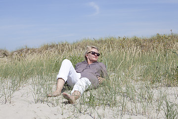 Image showing Vacationer relaxed in the dunes