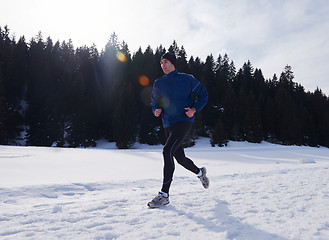 Image showing jogging on snow in forest