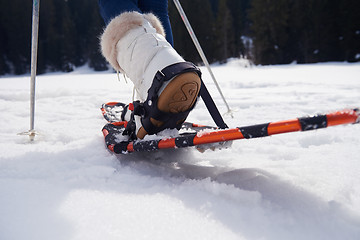 Image showing couple having fun and walking in snow shoes