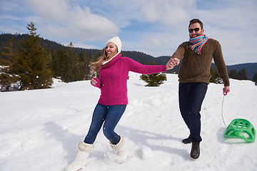 Image showing happy young couple having fun on fresh show on winter vacation