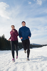 Image showing couple jogging outside on snow