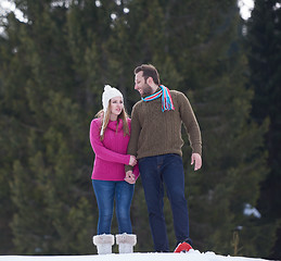 Image showing couple having fun and walking in snow shoes