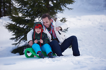 Image showing couple having fun and walking in snow shoes