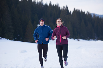 Image showing couple jogging outside on snow