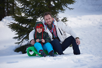 Image showing portrait of father and son on snow