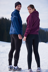 Image showing couple jogging outside on snow