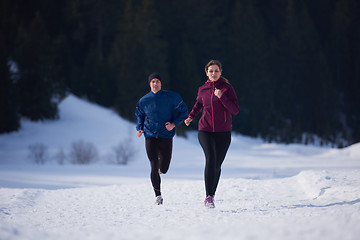 Image showing couple jogging outside on snow