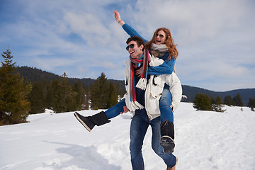 Image showing happy young couple having fun on fresh show on winter vacation