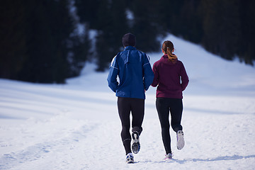 Image showing couple jogging outside on snow