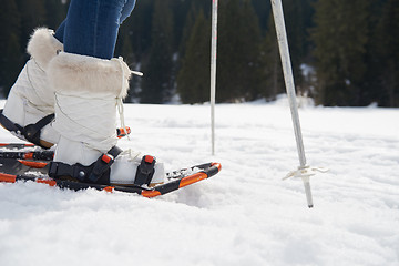 Image showing couple having fun and walking in snow shoes